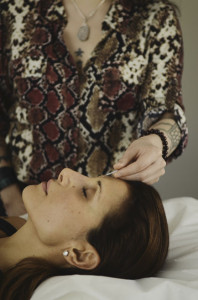 Photo of Margarita administering accupuncture